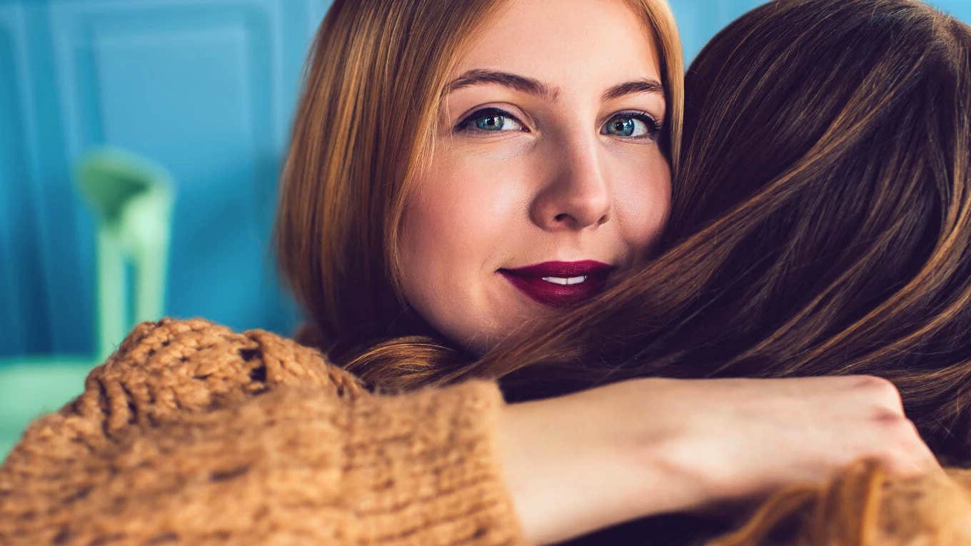 Boring Phrases Brilliant People Avoid At All Costs brilliant woman hugging friend avoiding boring conversation