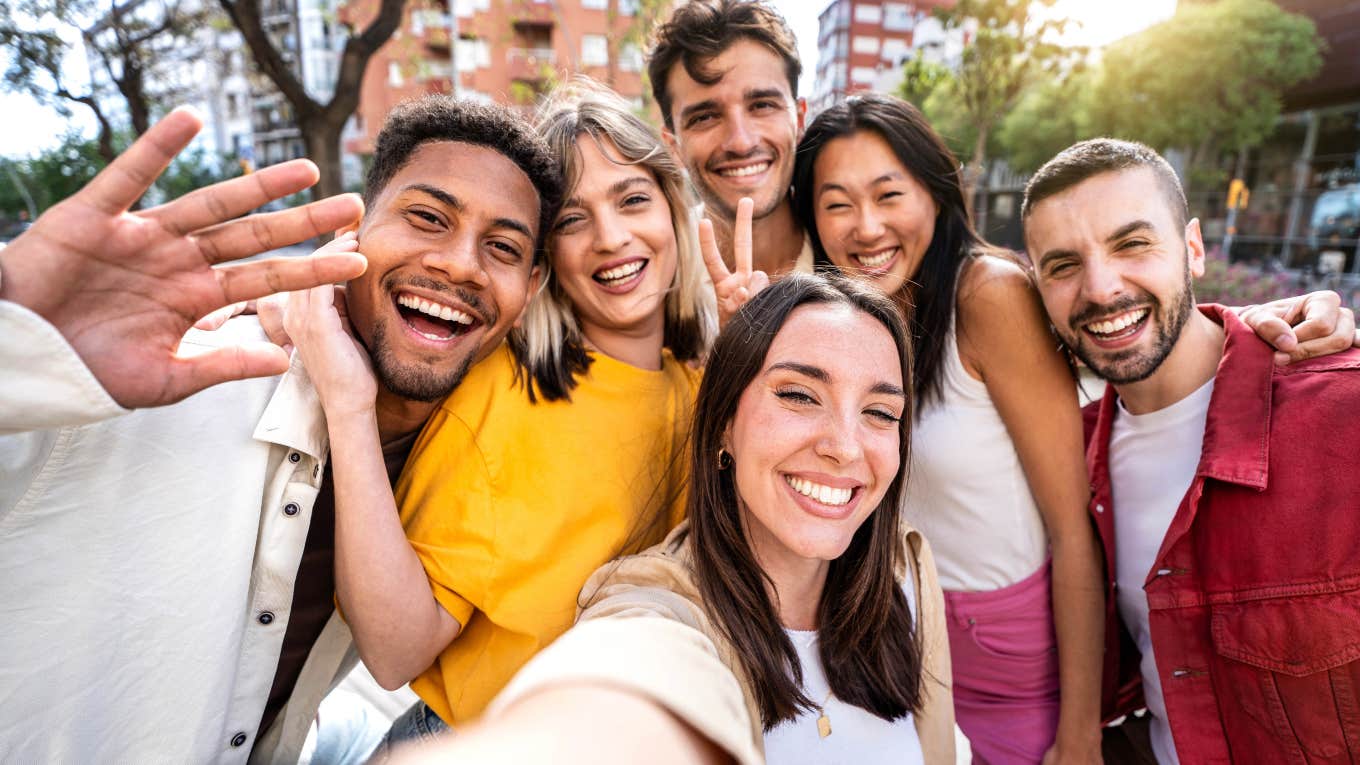 Life Skills Millennials Learned In The That Are Obsolete group of millennial friends smiling at camera