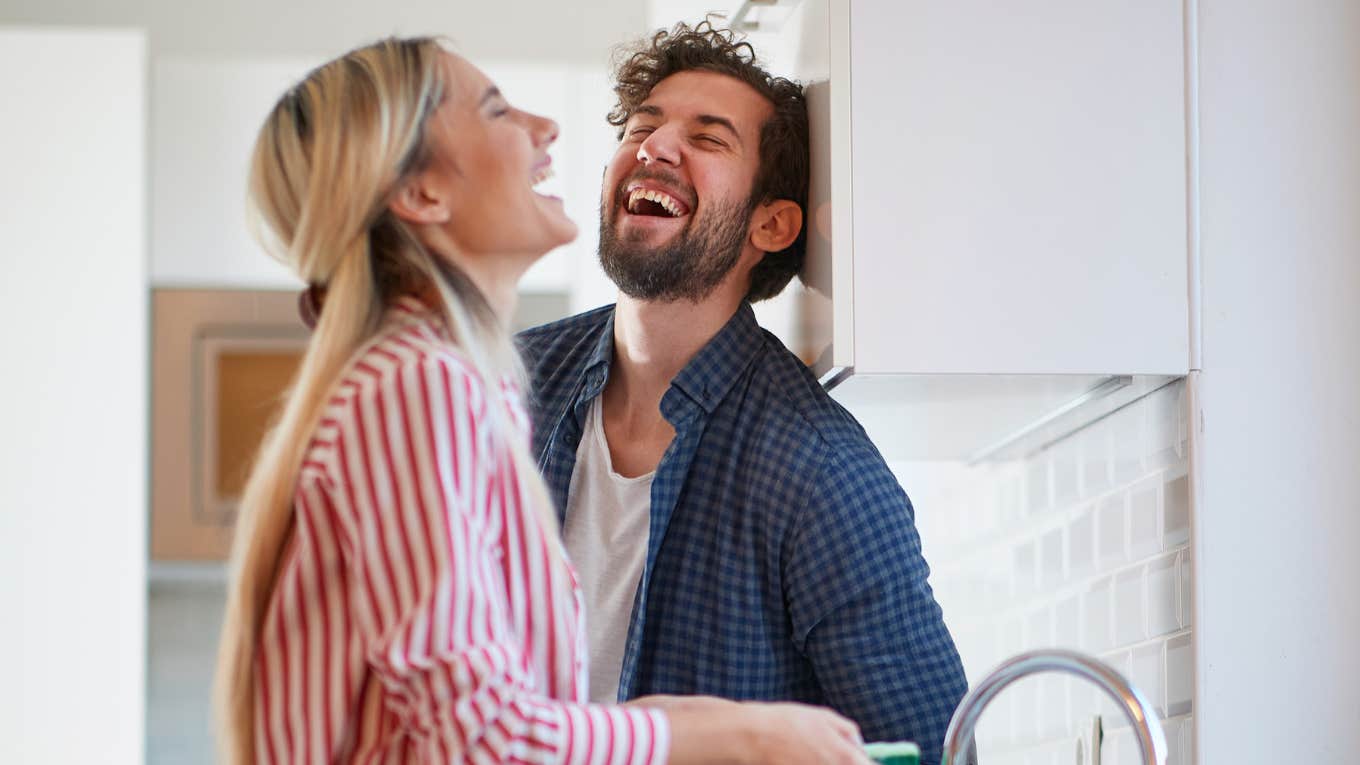 Parents Who Stay Married After Their Kids Grow Up Usually Have These Admirable Traits man and wife laughing together in the kitchen