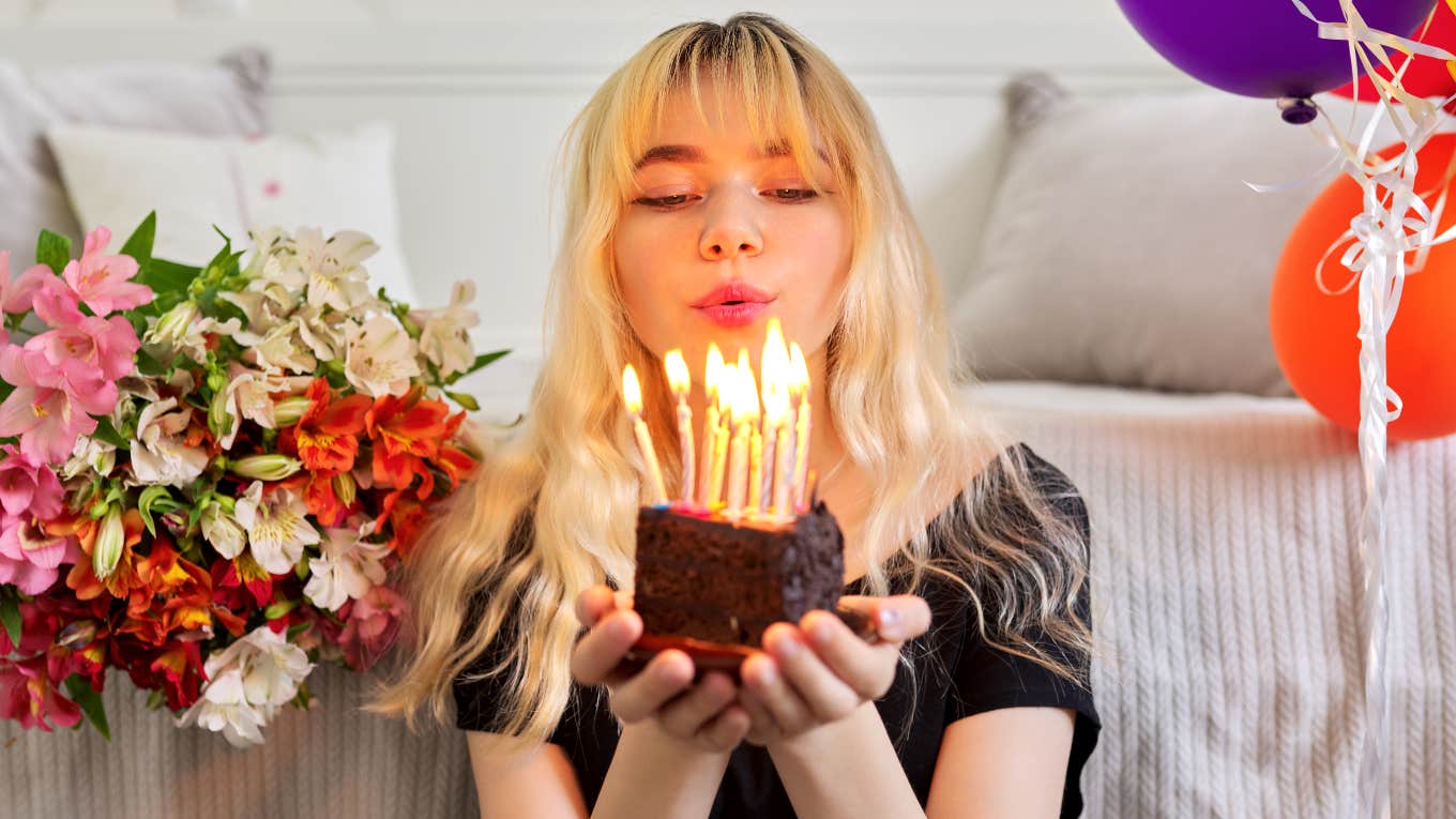 People Born On These Days Of The Month Are Destined For Financial Success Woman destined for financial success holding birthday cake