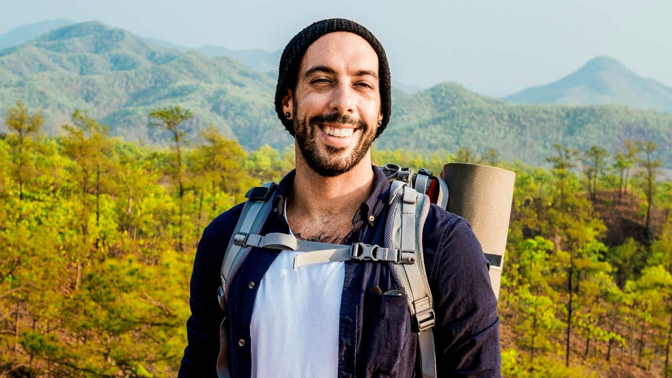 Signs Your Mind Is Mentally Stronger Than Most, According To Research Man with a mentally strong mind, hiking.