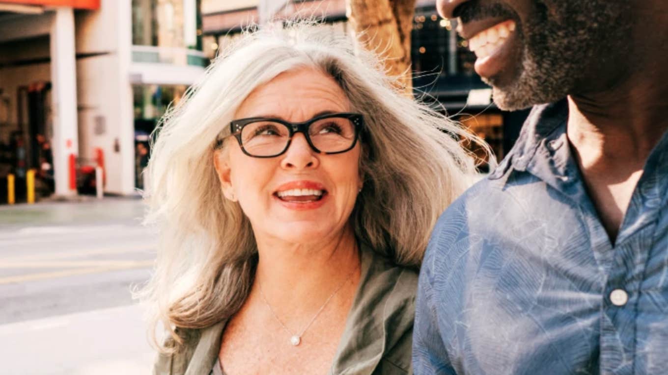 Tiny Gestures Speak Loudly Happy Marriages Mature woman smiles lovingly at husband's gestures in a happy marriage