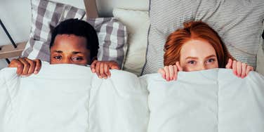 Shy, embarrassed couple, bedroom buzzkill