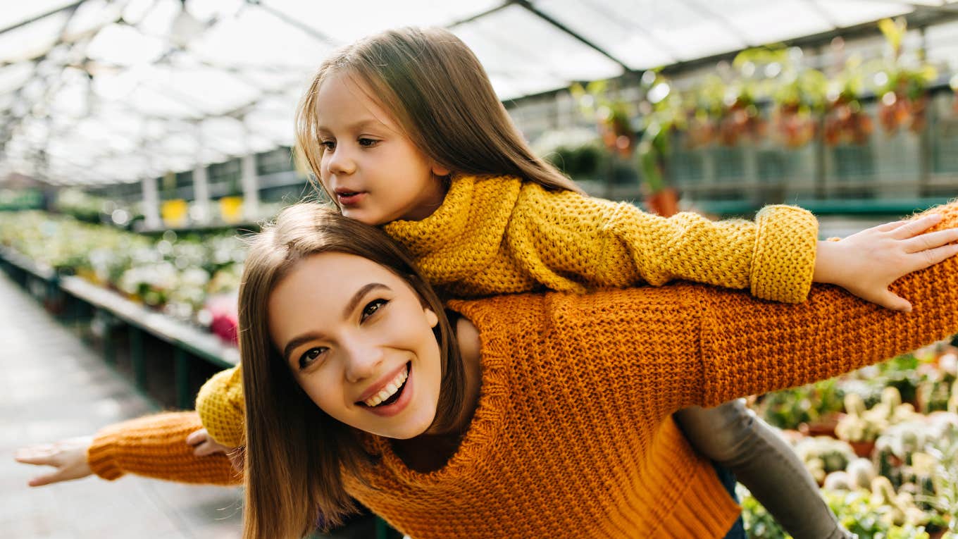 Your Parents Did A Great Job Raising You If You Believed These Lies Growing Up Laughing emotional woman posing in greenhouse with kid